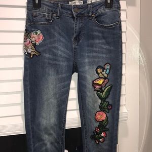 denim jeans with colorful flower detail